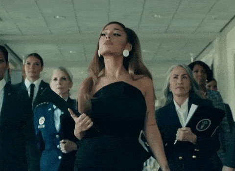 Ariana Grande walking in front of her White House Staff in her music video "Positions."