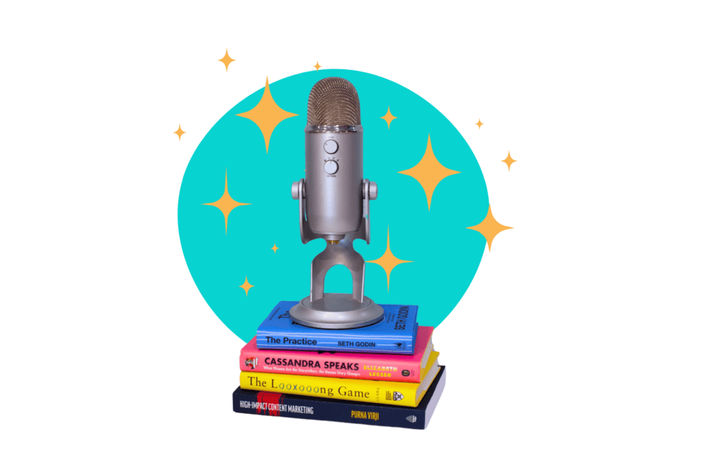 a podcast mic sitting on a stack of books