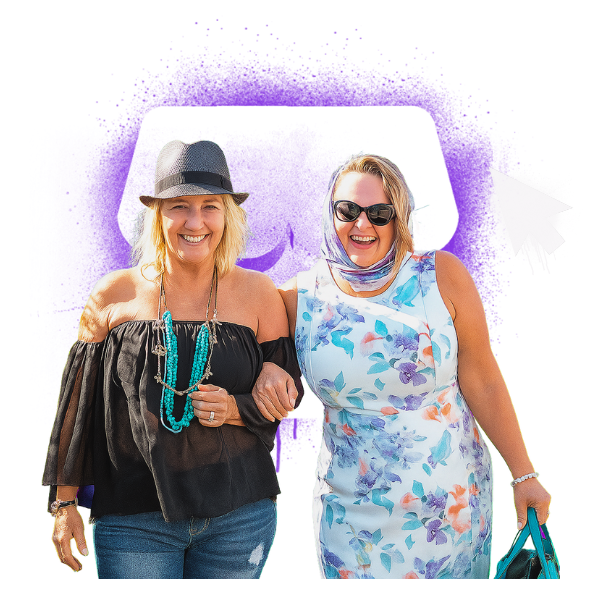 Two Realign Consulting clients, arm-in-arm and smiling