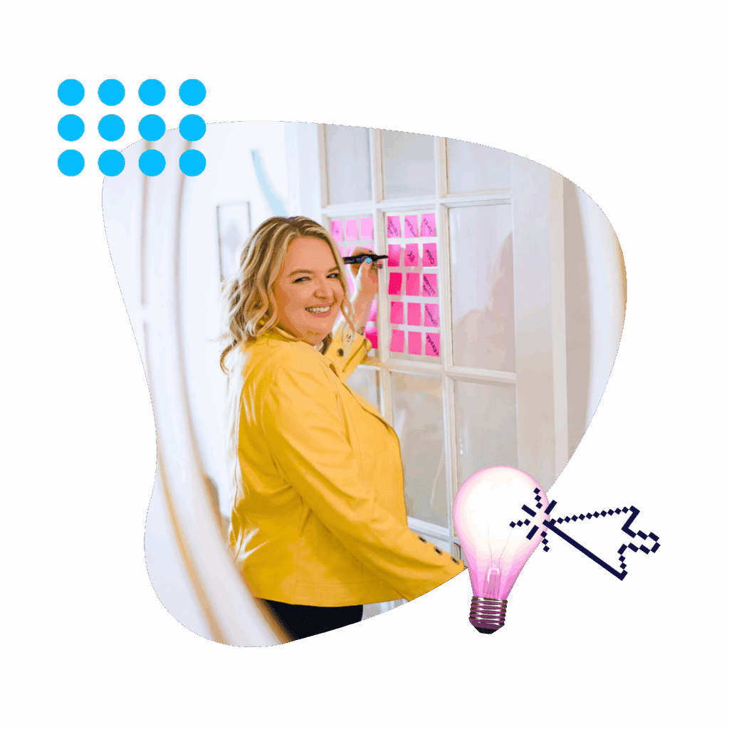Fractional CMO Renia Carsillo writing on sticky notes displayed on a window