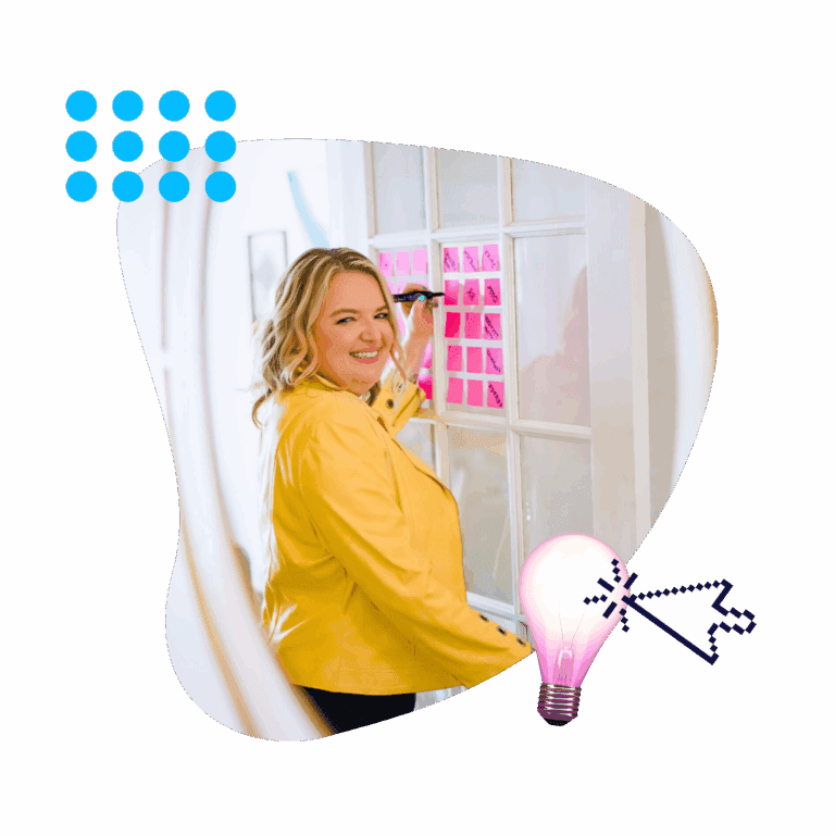 Fractional CMO Renia Carsillo writing on sticky notes displayed on a window