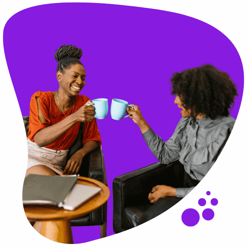 two people toasting with coffee mugs